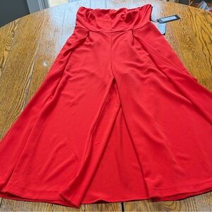Gabrielle Union red jumpsuit with attached skirt. Collab with NY&C size medium.